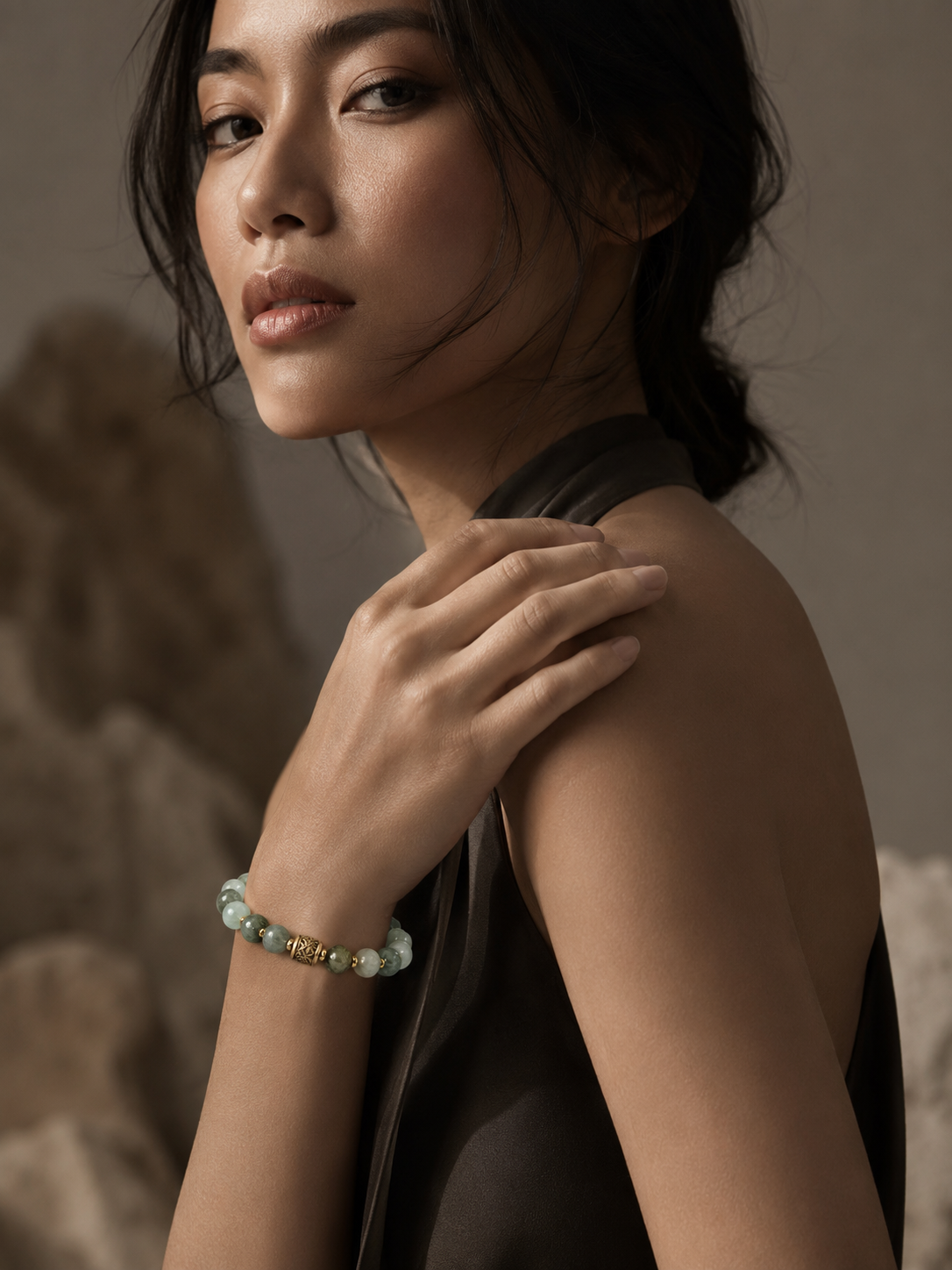 Model in sculpted studio light wearing the Sea Glass bracelet